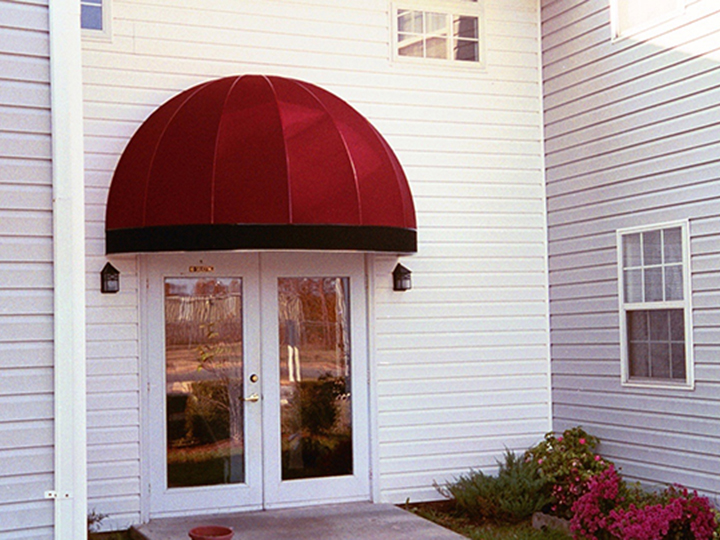 Red round canopy over top double doors